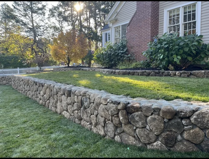 Natural stone wall and lawn